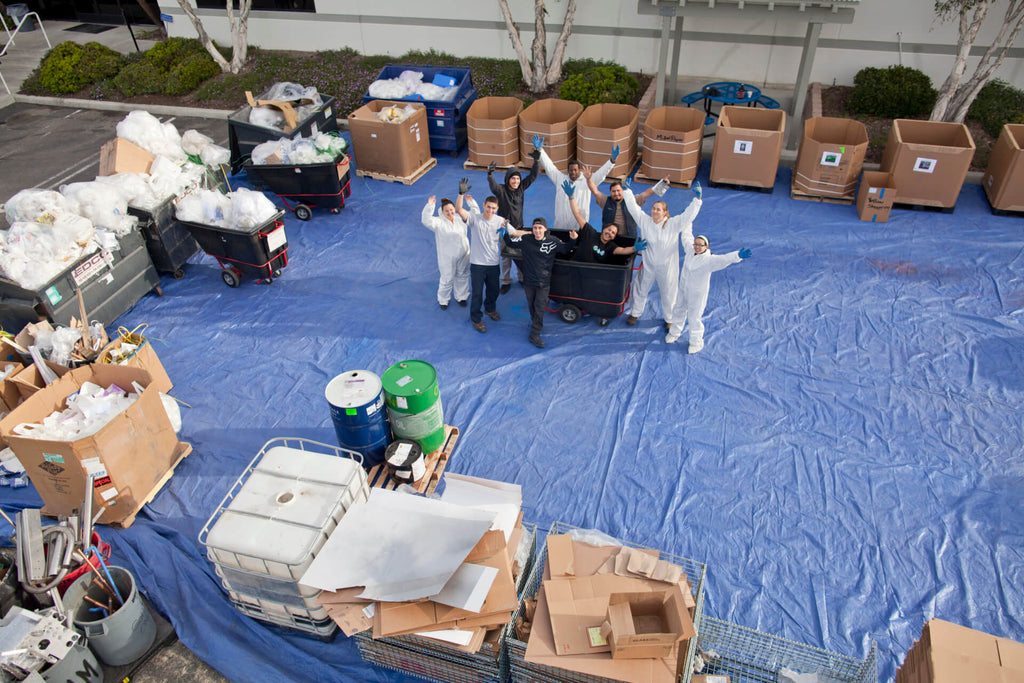 Dr. Bronner employees sort through the waste. 