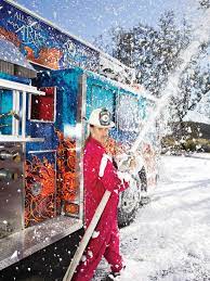 A fireman spraying the hose on the Magic Fire Truck.