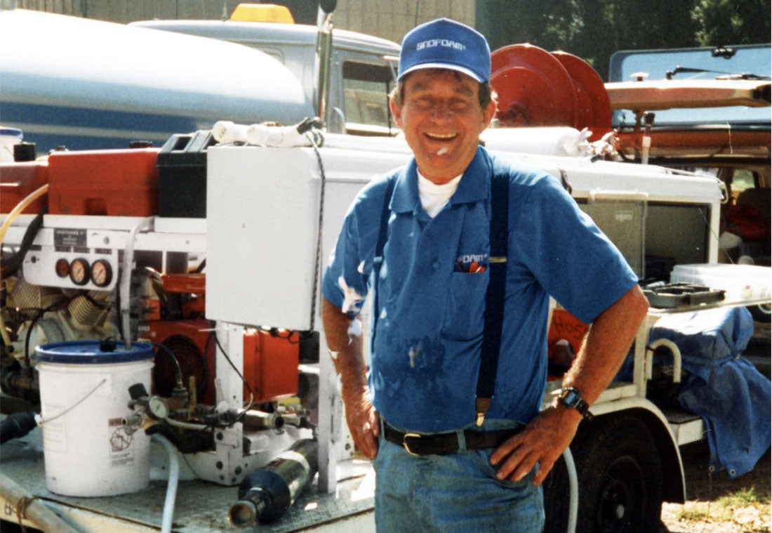 Photo of Ralph in front of chemical equipment.